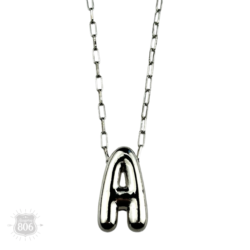 Silver letter pendant on necklace, initial monogram
