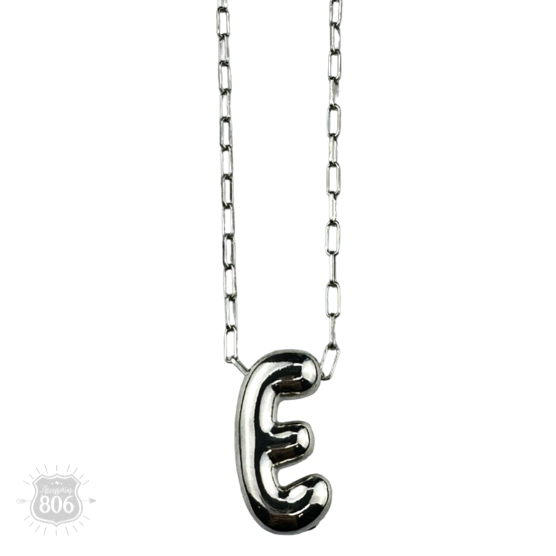Silver letter pendant on necklace, initial monogram